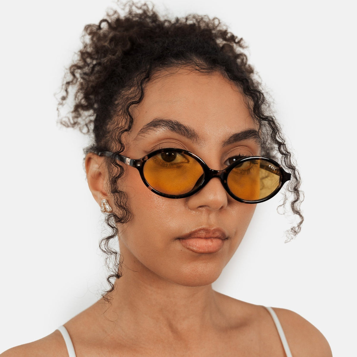 ROC Reboot sunglasses in tortoiseshell with yellow lens, worn