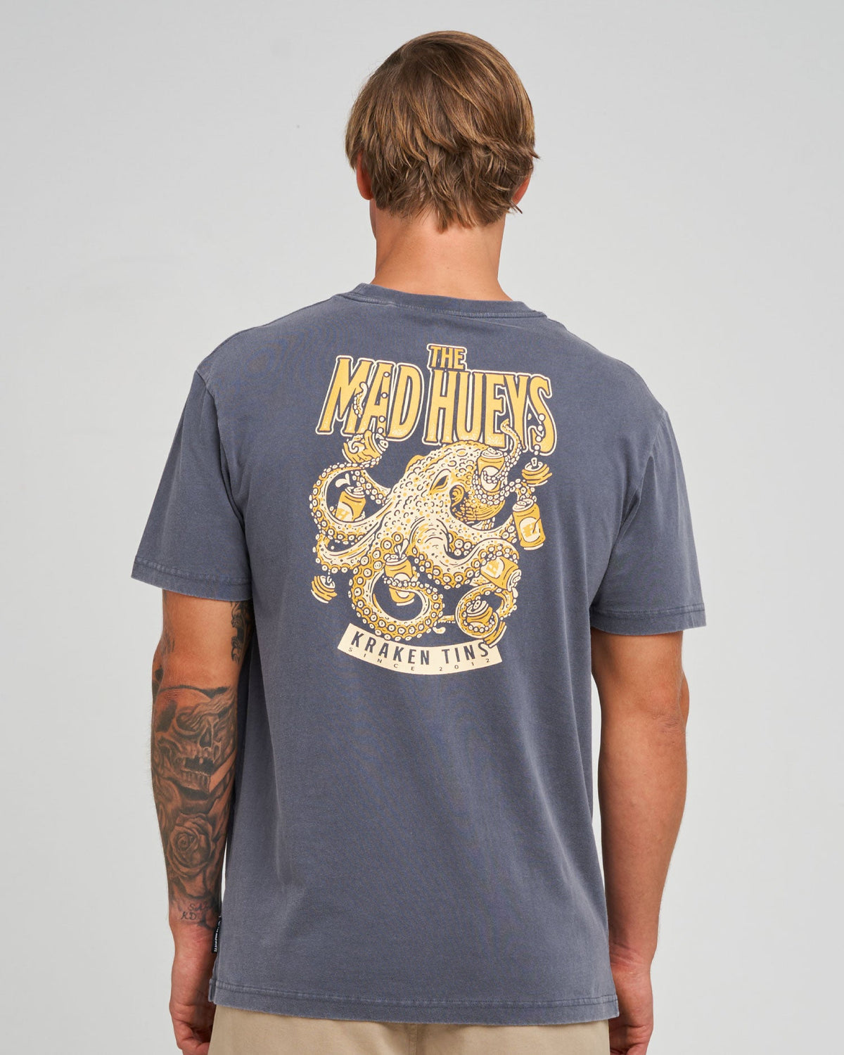 The Mad Hueys Kraken Tins tee in washed petrol blue
