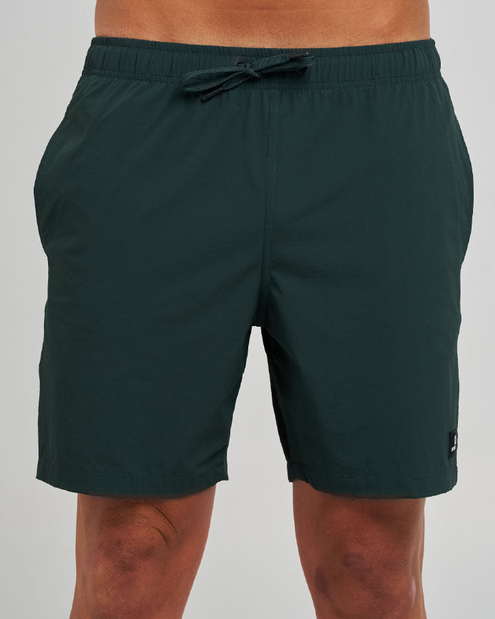 The Mad Hueys Freestyle 18 inch Swim Volley Short in pine green - front