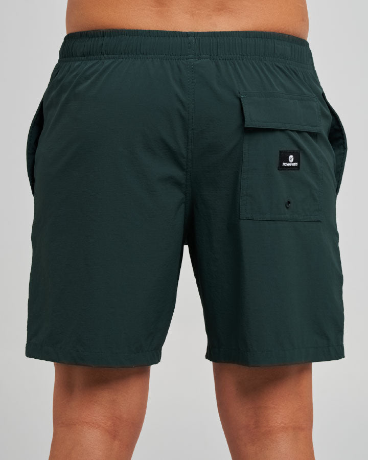 The Mad Hueys Freestyle 18 inch Swim Volley Short in pine green - back