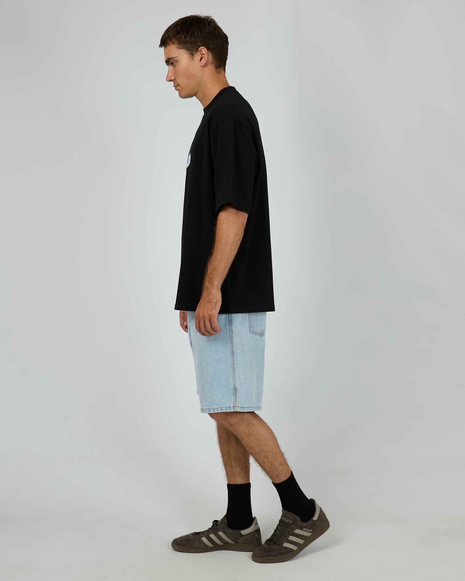 Silent Theory World Box Tee Black - worn on model side view