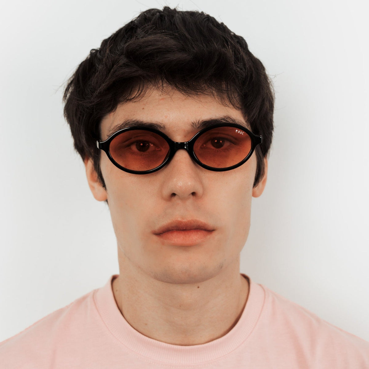 ROC Reboot sunglasses in black with tangerine gradient lens, worn