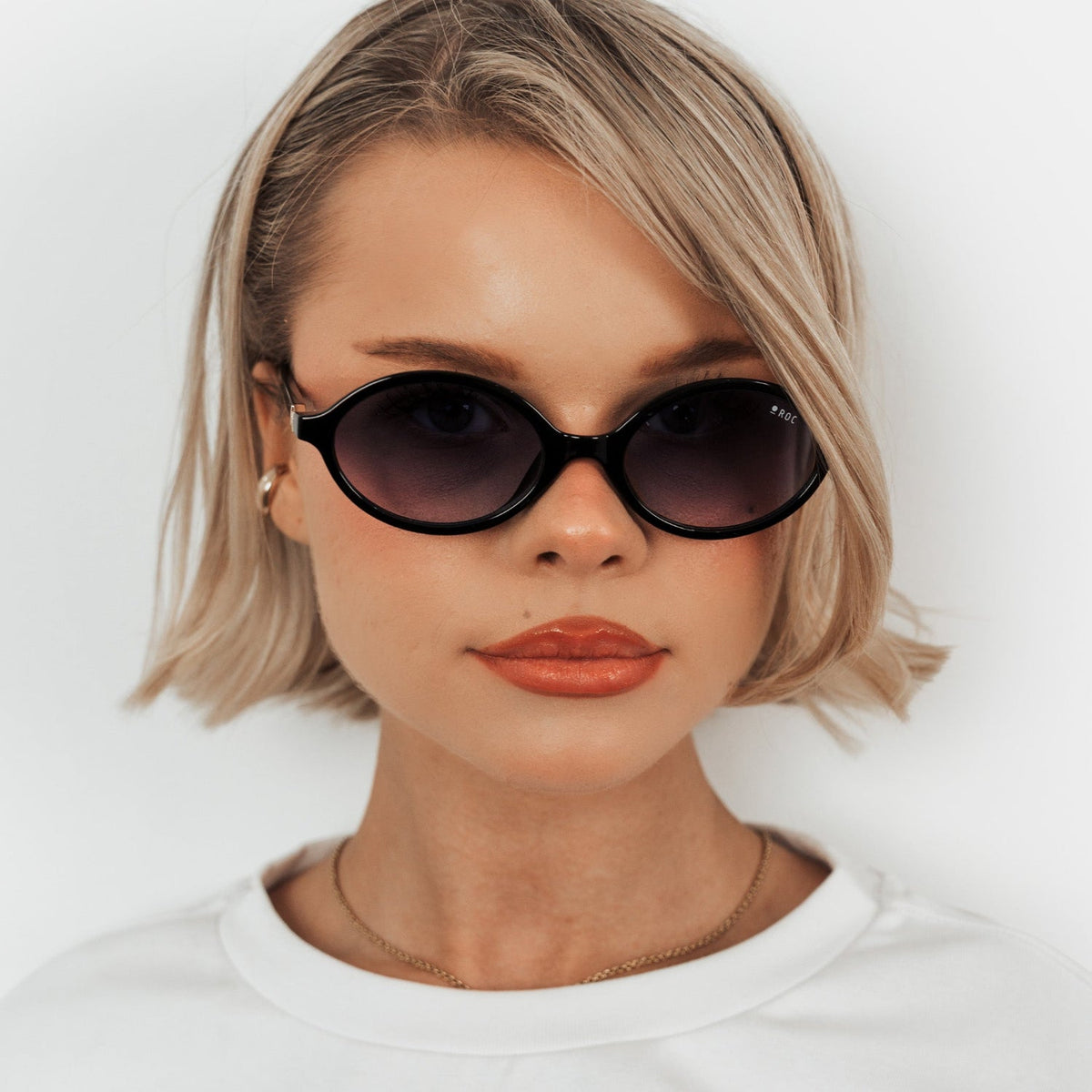 ROC Reboot sunglasses in black with blue gradient lens, worn