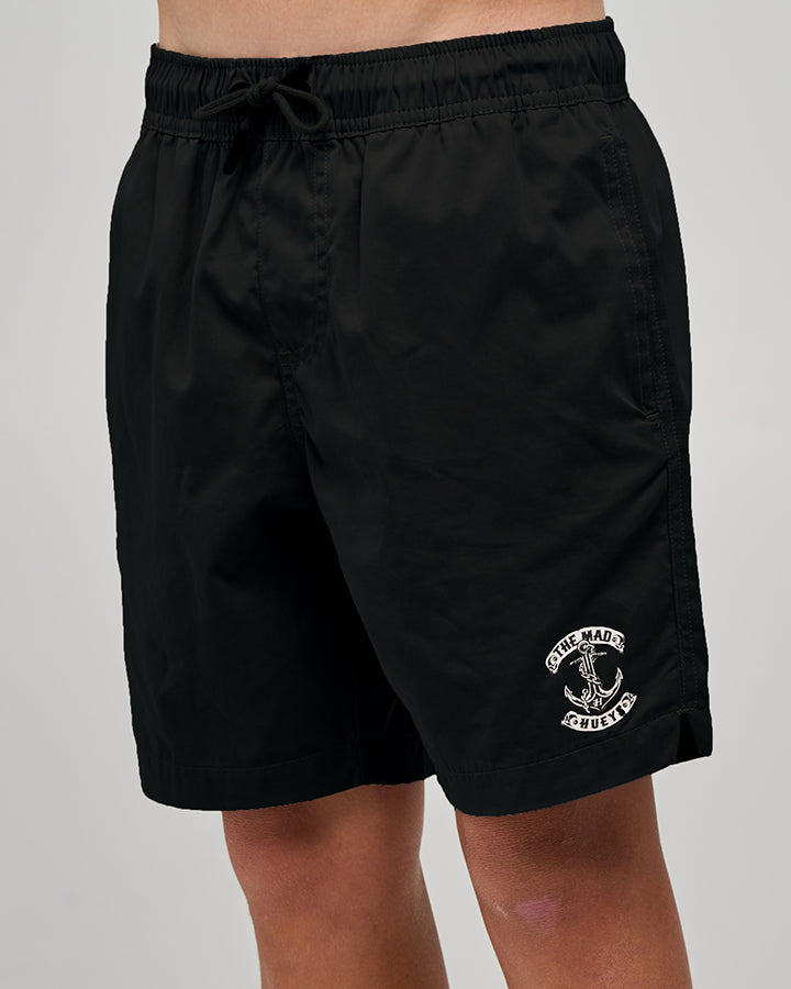 The Mad Hueys Skull Anchor Youth 16 inch Volley Short in black - worn