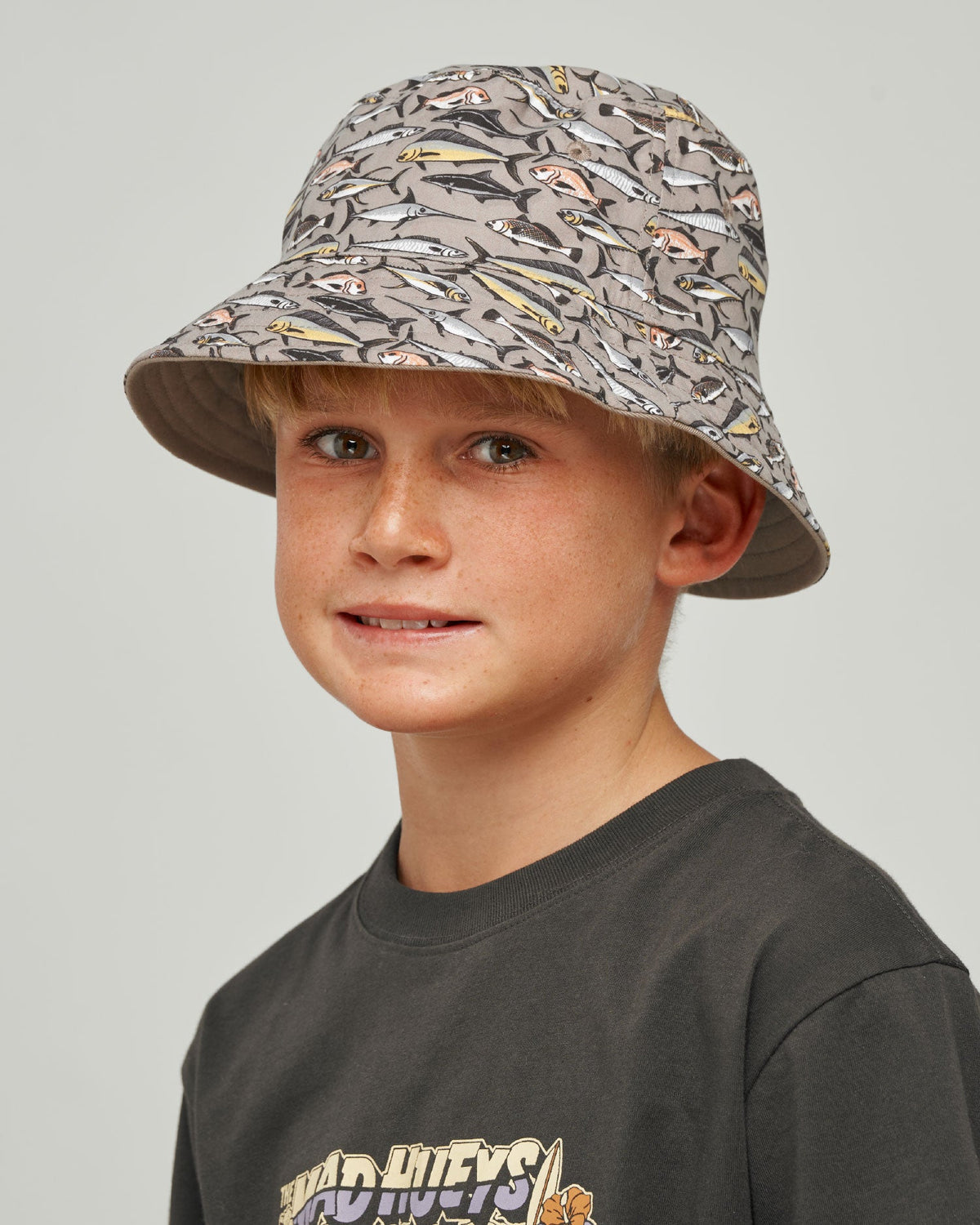 Mad Hueys Pro Hueys Youth Reversible Bucket Hat in taupe - worn