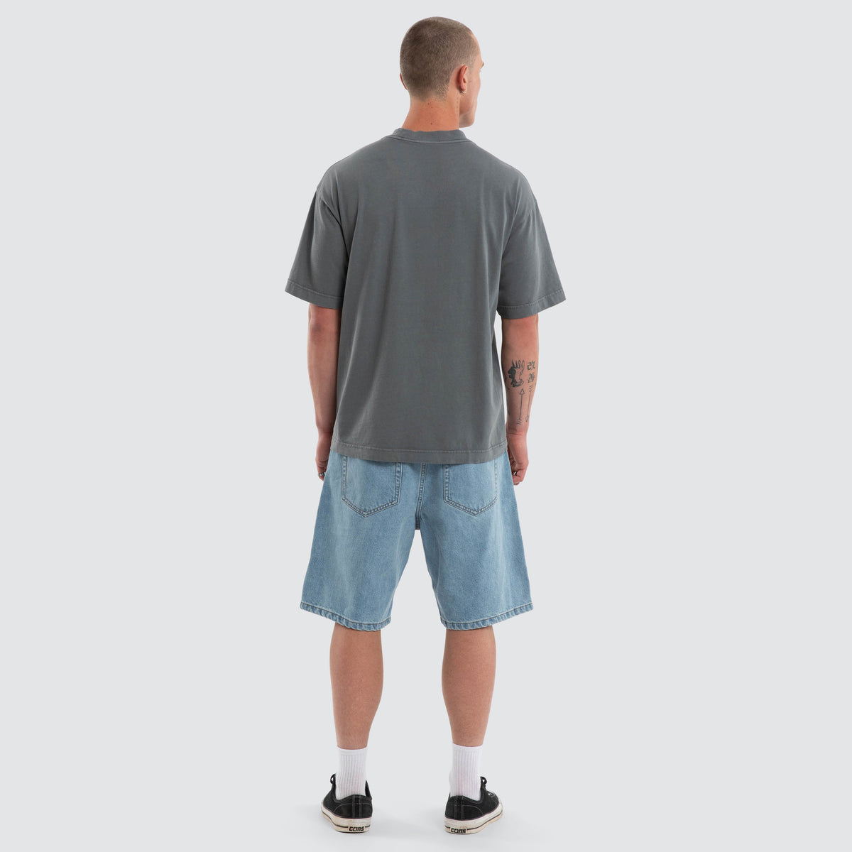 Nomadic Merch street tee in pigment dark slate, back view