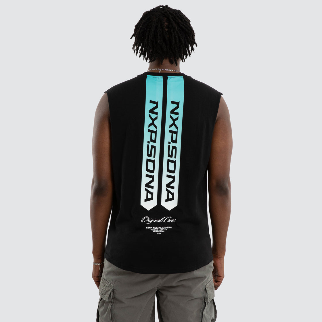 Person wearing a black sleeveless shirt with branding on the back against a white background